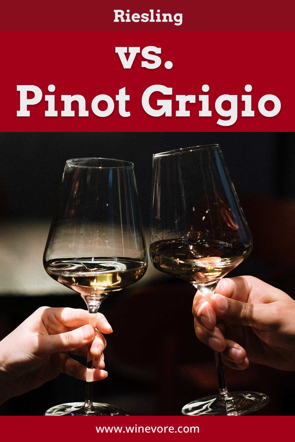 Man and woman's hand clinking wine glasses - Riesling vs. Pinot Grigio.