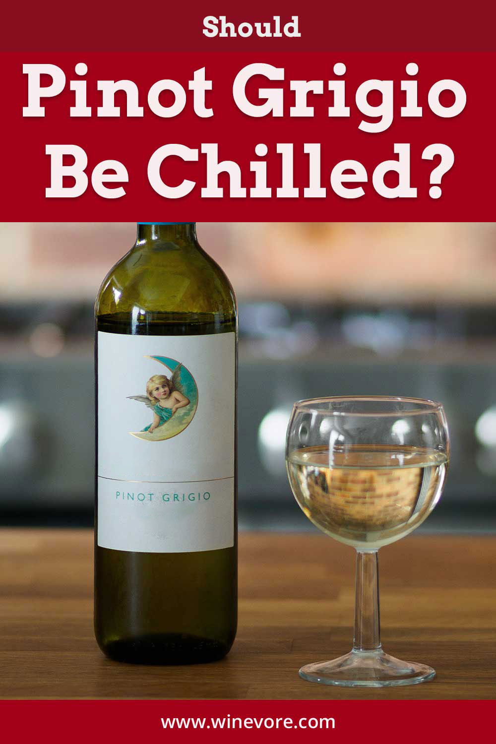 A bottle of Pinot Grigio and a wine glass on a wooden surface - Should it Be Chilled?