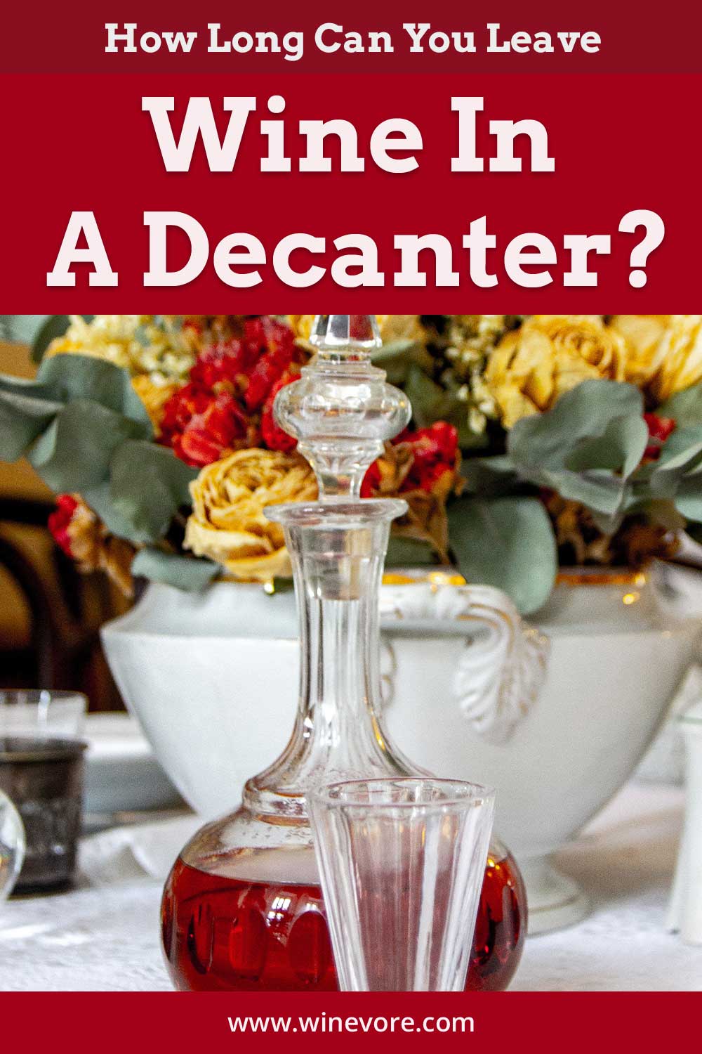 Wine in a decanter in front of flowers - How Long Can You Leave Wine In A Decanter?