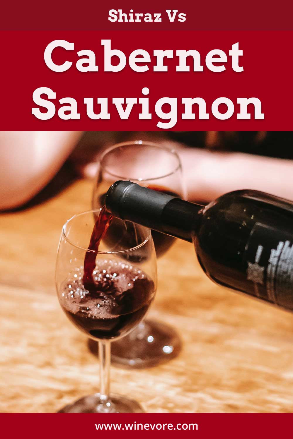 Pouring red wine into a glass from a bottle - Shiraz Vs Cabernet Sauvignon.
