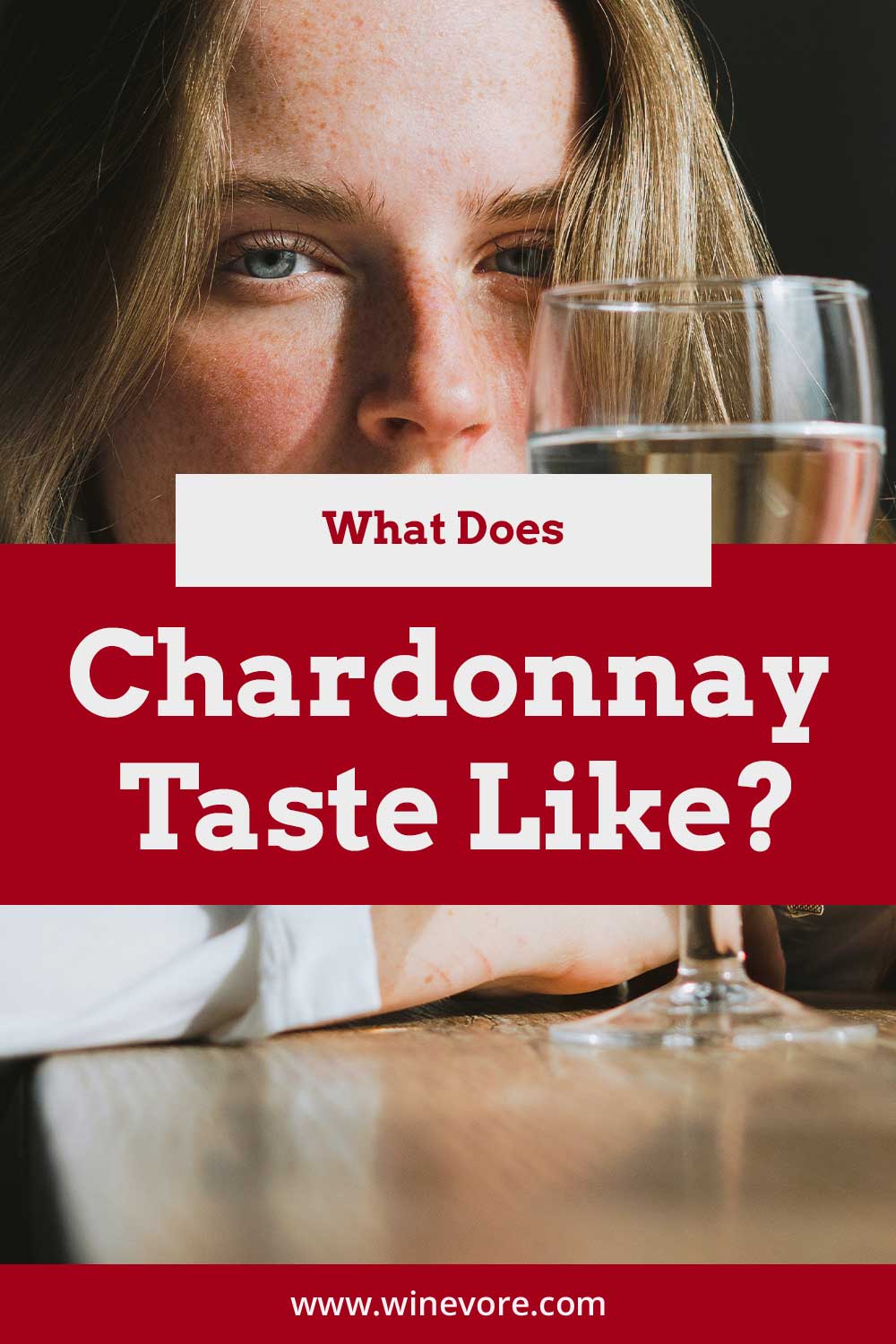 Woman with a wine glass in front of her face - What Does Chardonnay Taste Like?