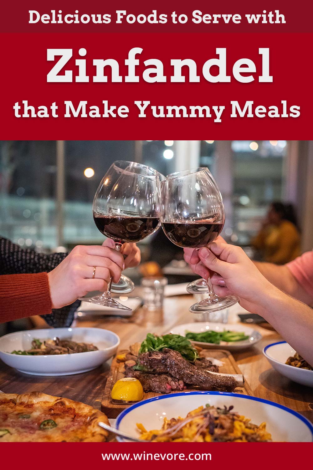 Four hands clinking wine glasses on a table - Foods to Serve with Zinfandel.