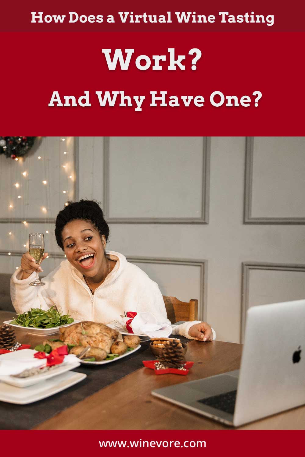 Woman with a wine glass sitting in front of a table and a laptop - How Does a Virtual Wine Tasting Work?