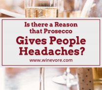 Wine glasses with a bottle on a wooden surface - Is there a Reason that Prosecco Gives People Headaches?