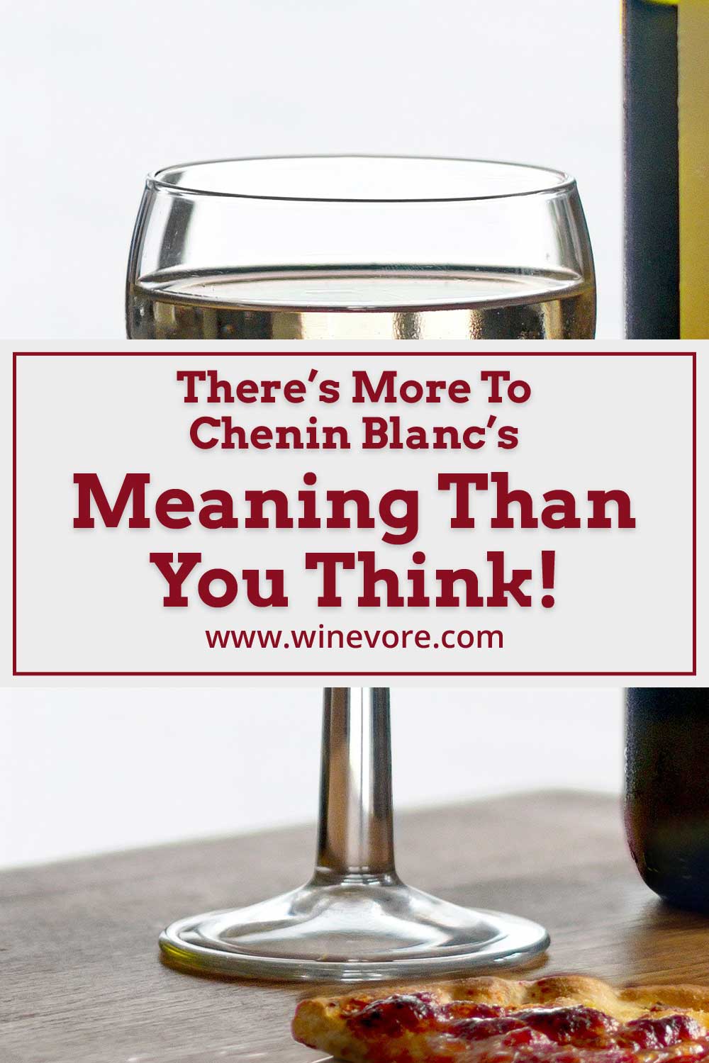 A wine glass near a slice of pizza - Chenin Blanc's Meaning.