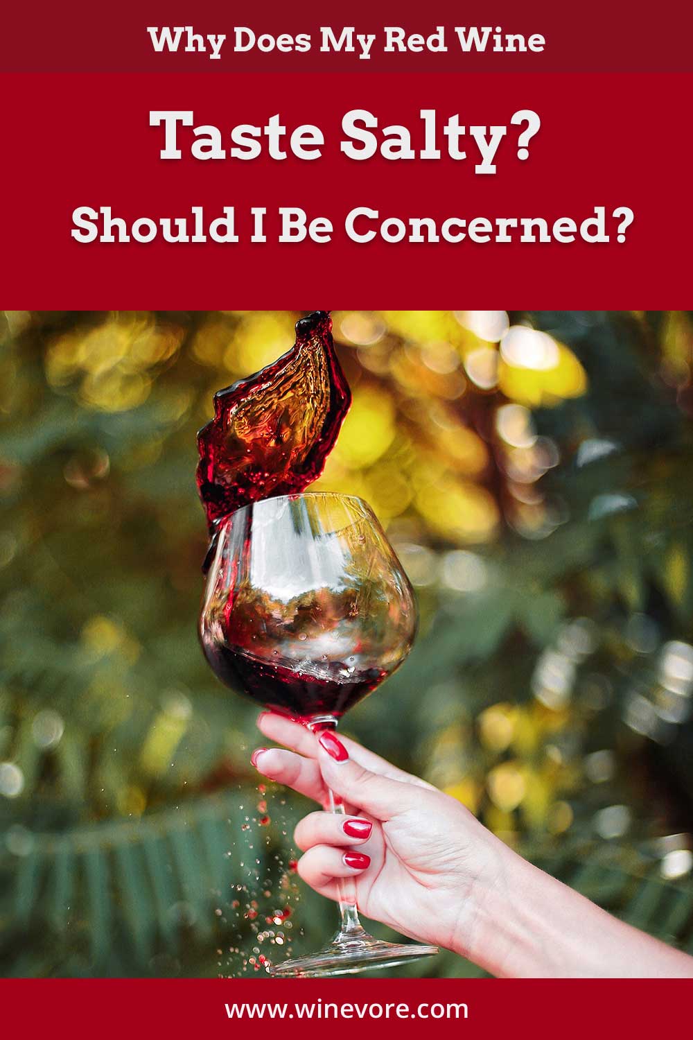 Wine spilling out of a wine glass held by a woman's hand - Why Does My Red Wine Taste Salty?