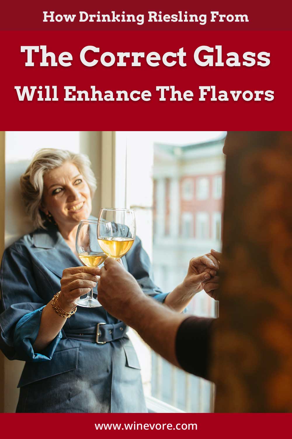 Woman clinking wine glass while standing near a window - Drinking Riesling From The Correct Glass.