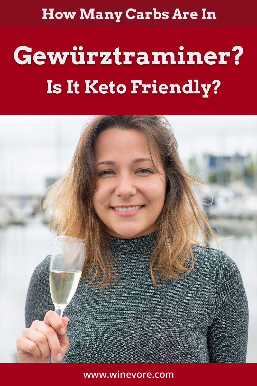 Woman smiling with a wine glass in hand standing in front of a lake - How Many Carbs Are In Gewürztraminer?