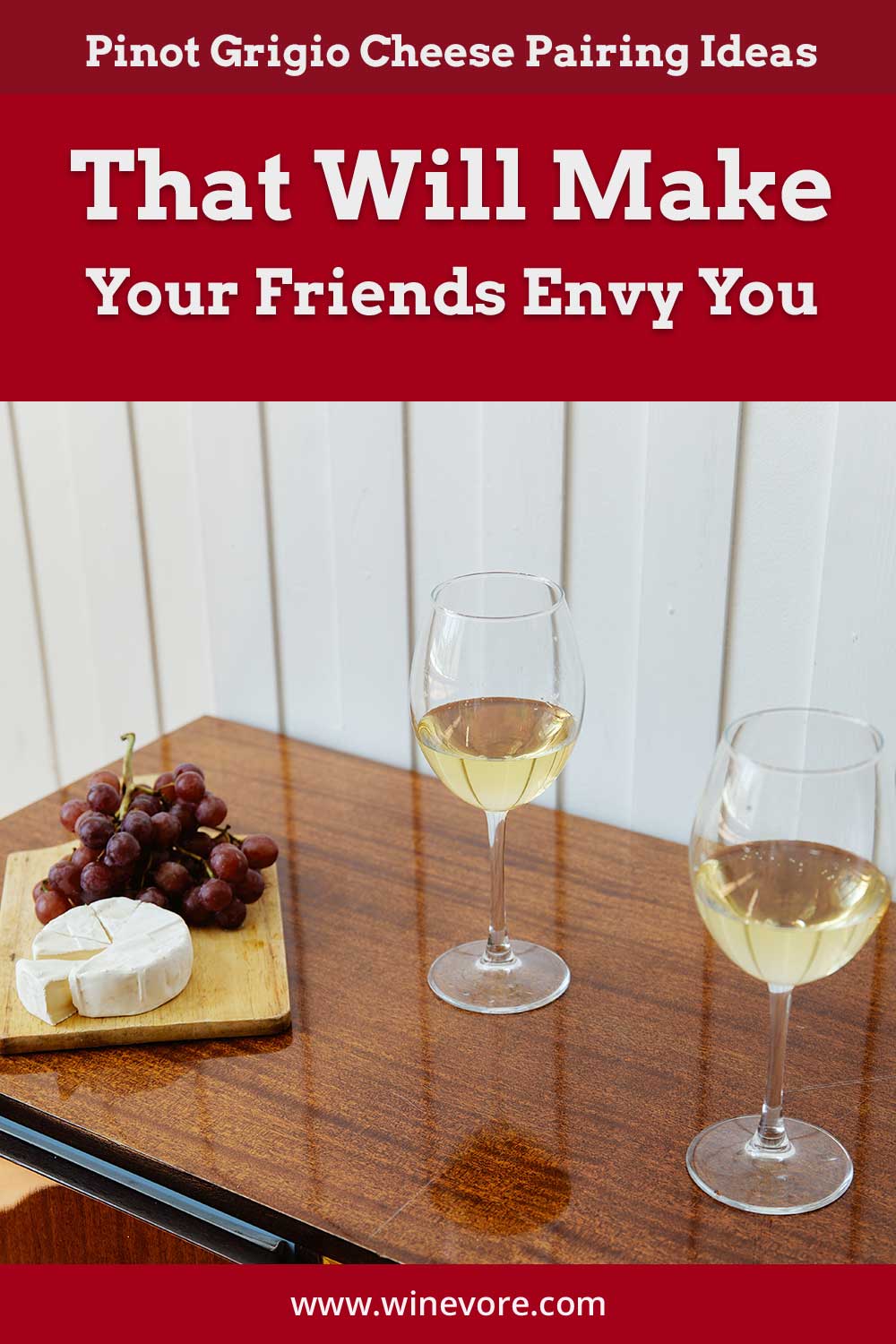 Two wine glasses near grapes and cheese - Pinot Grigio Cheese Pairing Ideas.