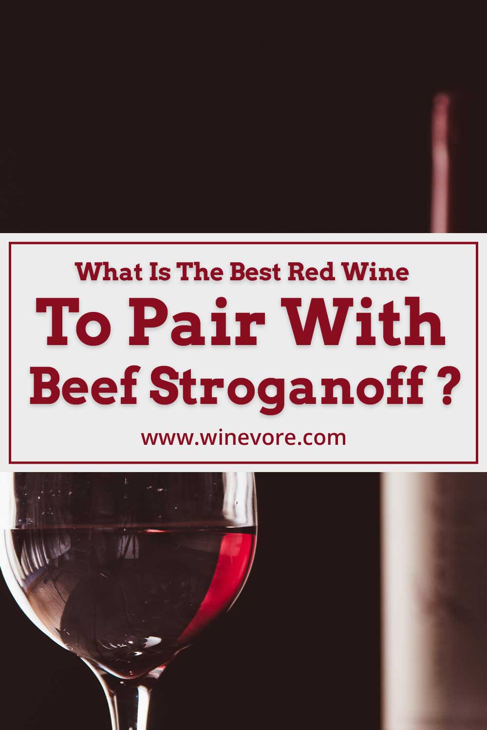 A wine glass in front of a wine bottle - What Is The Best Red Wine To Pair With Beef Stroganoff ?