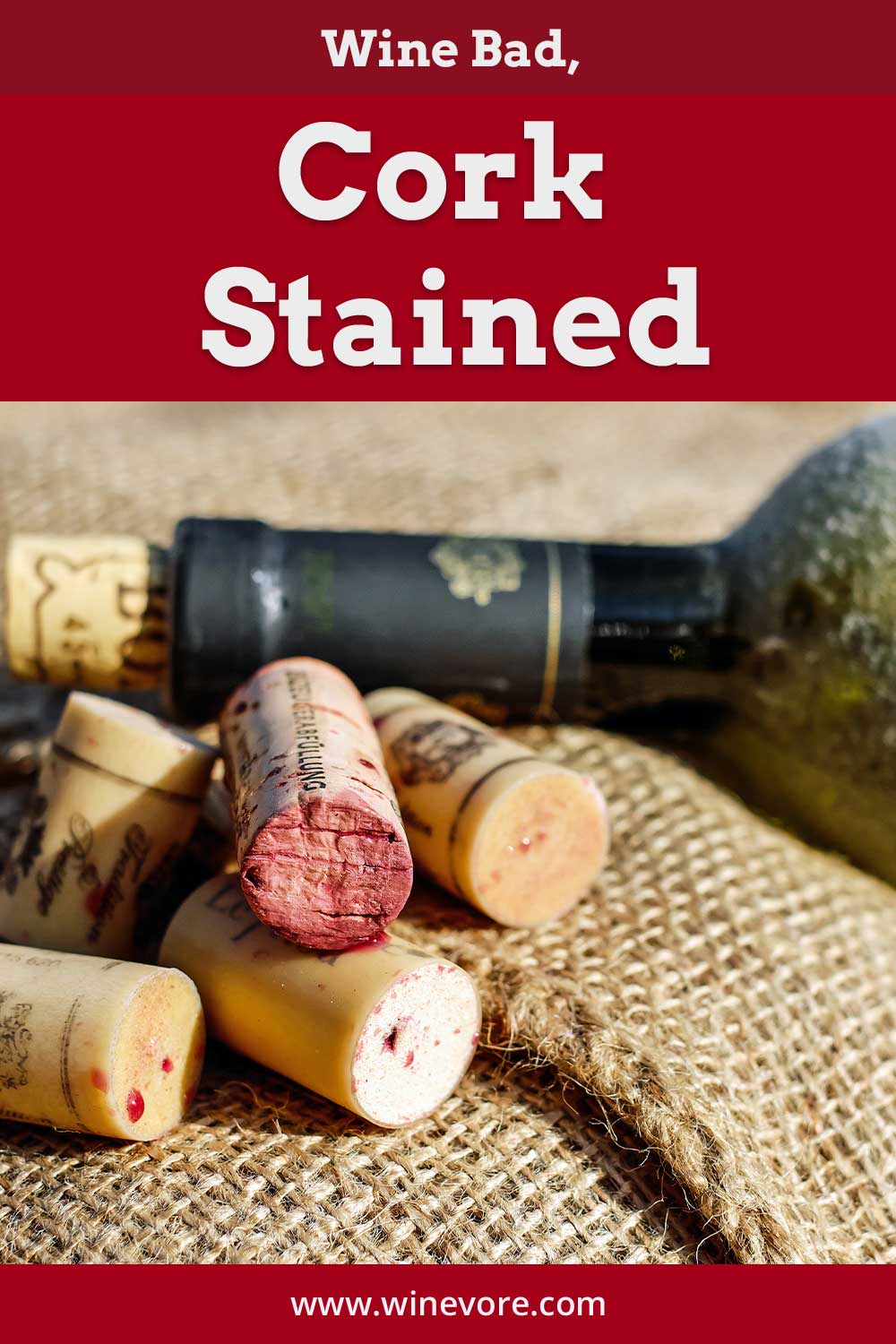 An old bad wine bottle and some stained corks